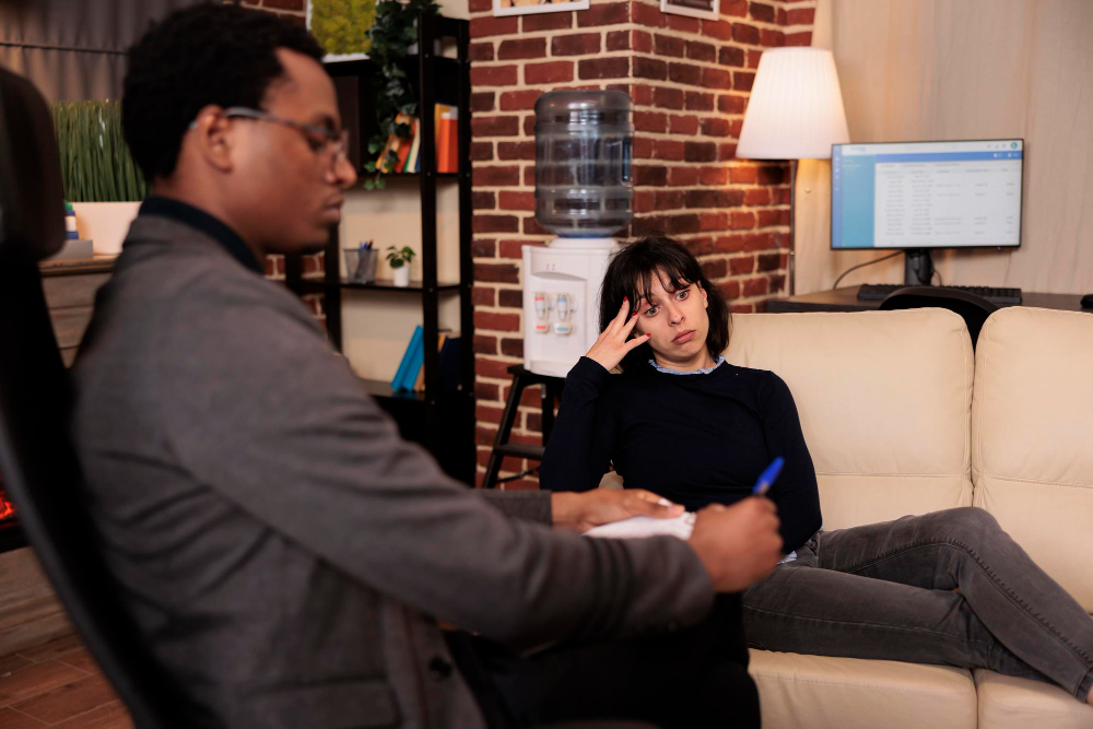 A therapy session where a woman opens up about emotional burnout, representing Bloom With Therapy’s support for those who appear strong but feel overwhelmed inside.